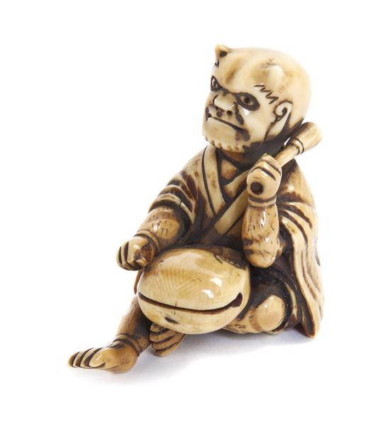 An Ivory Netsuke of an Oni the