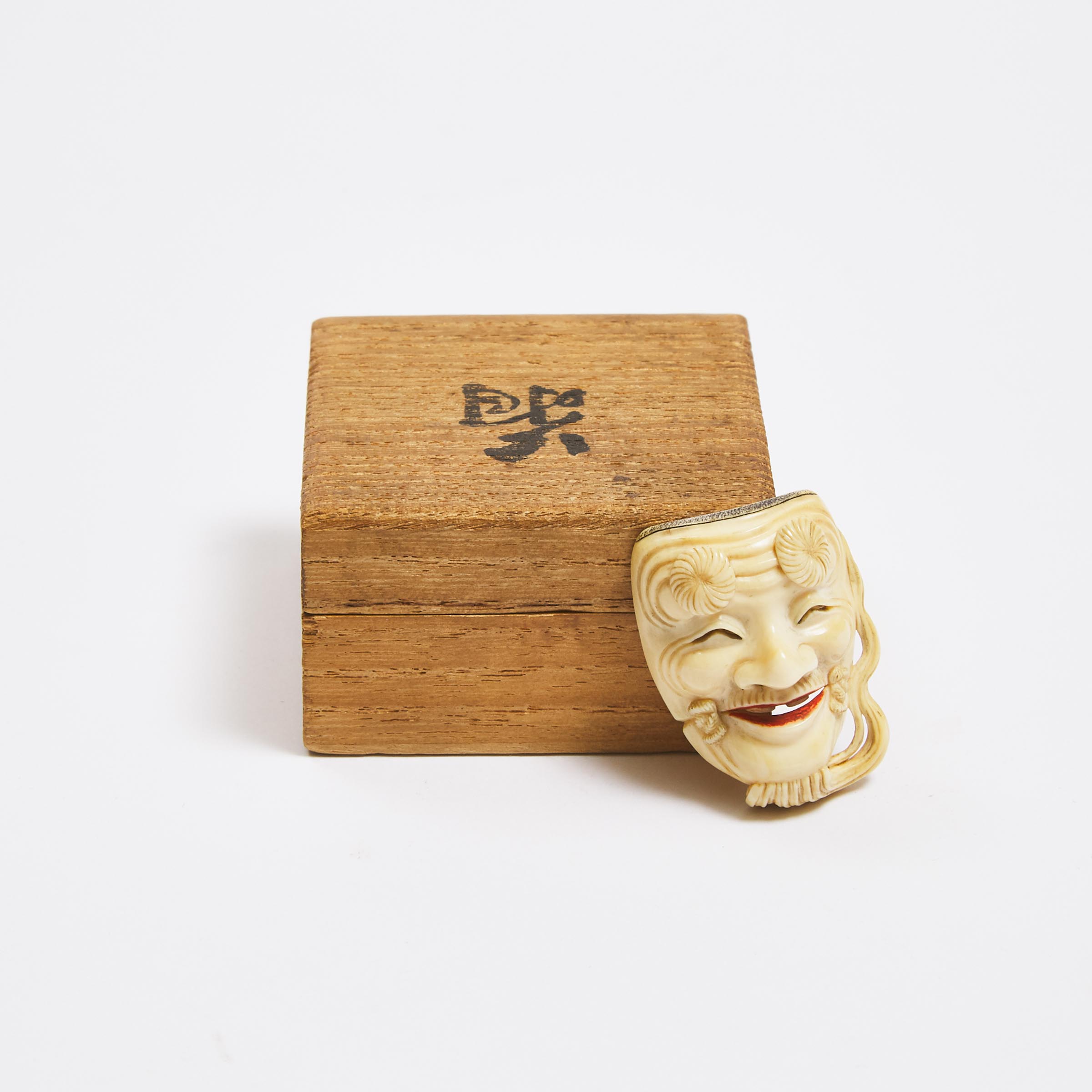An Ivory Noh Mask Netsuke of