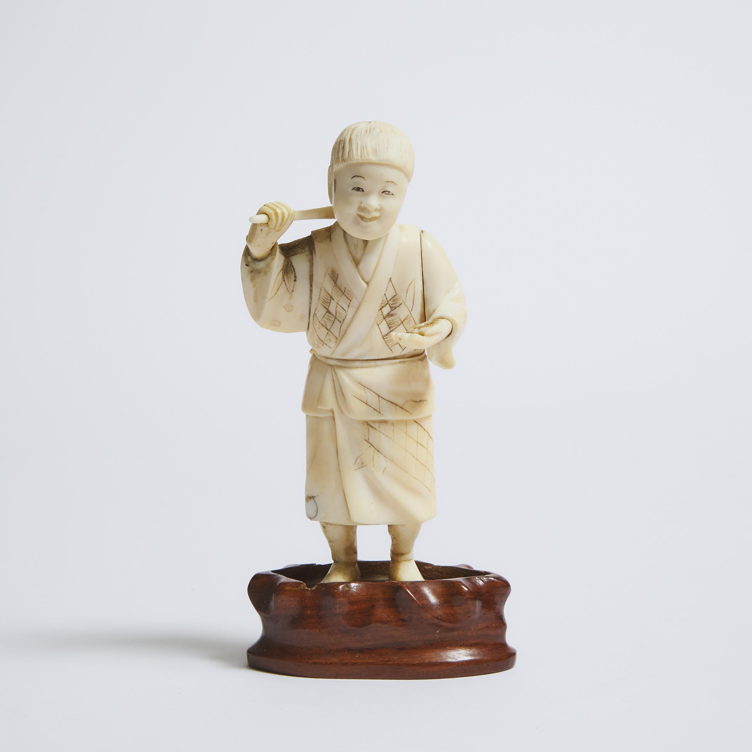 An Ivory Okimono of a Child,