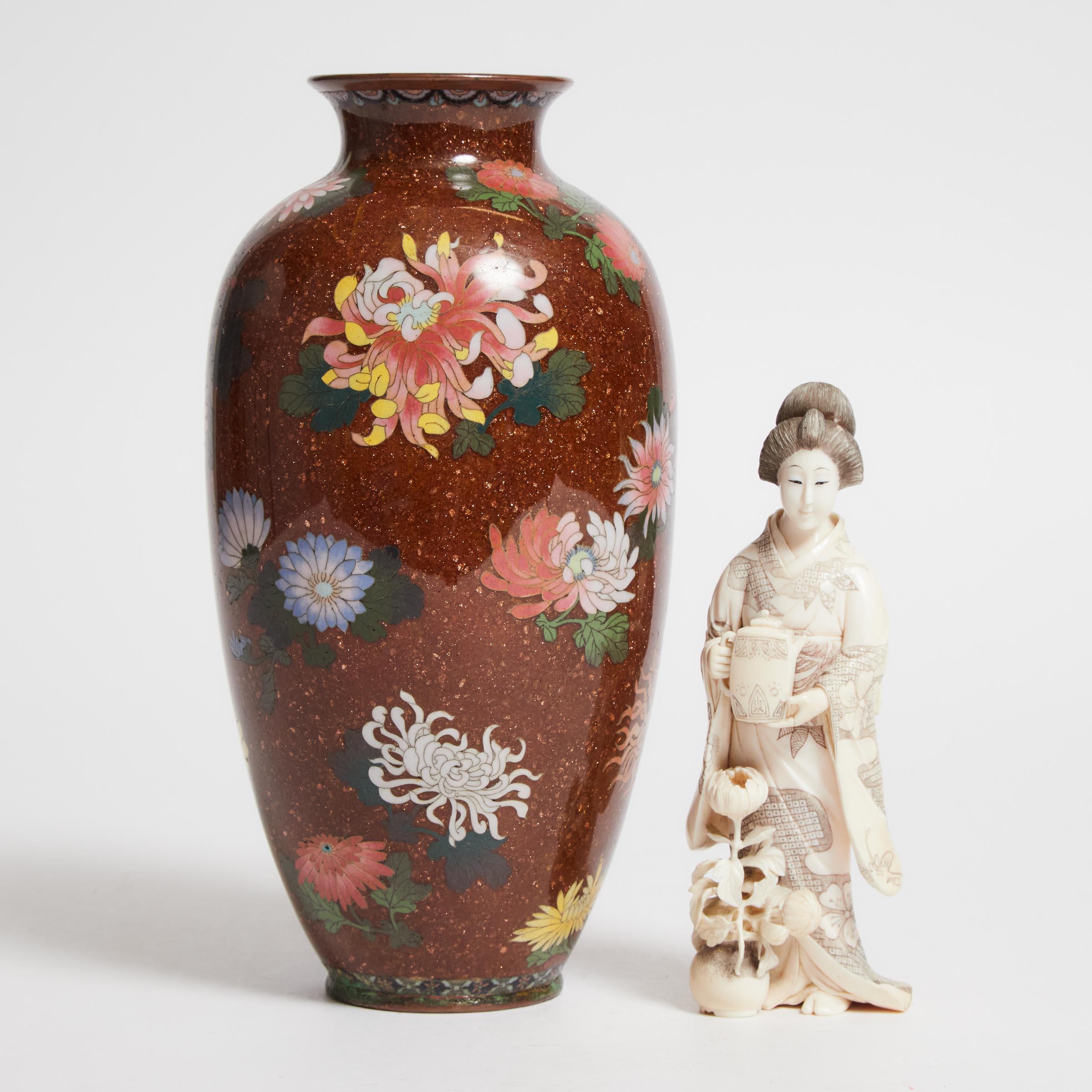 An Ivory Okimono of a Lady,