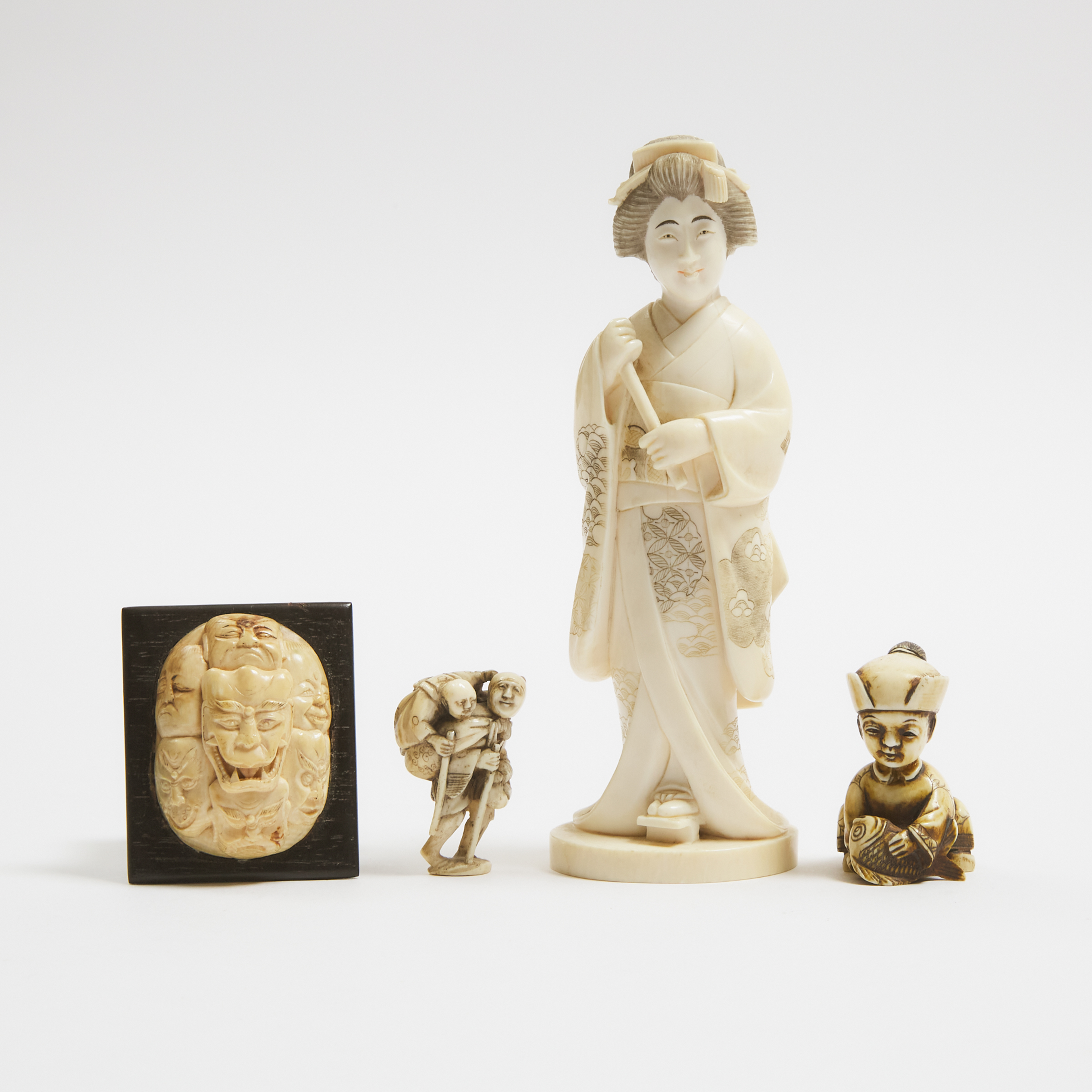 An Ivory Okimono of a Lady,