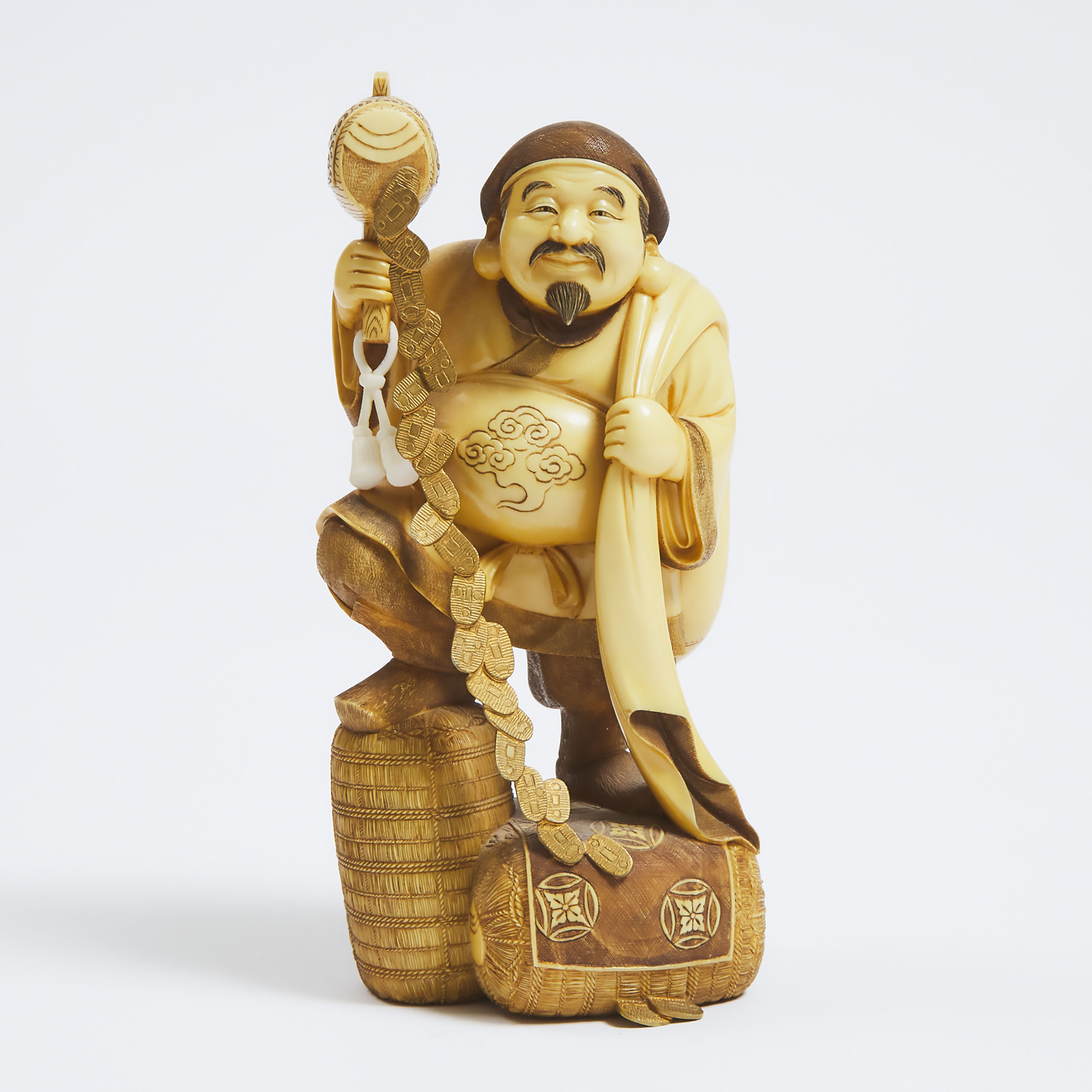 An Ivory Okimono of Daikoku,