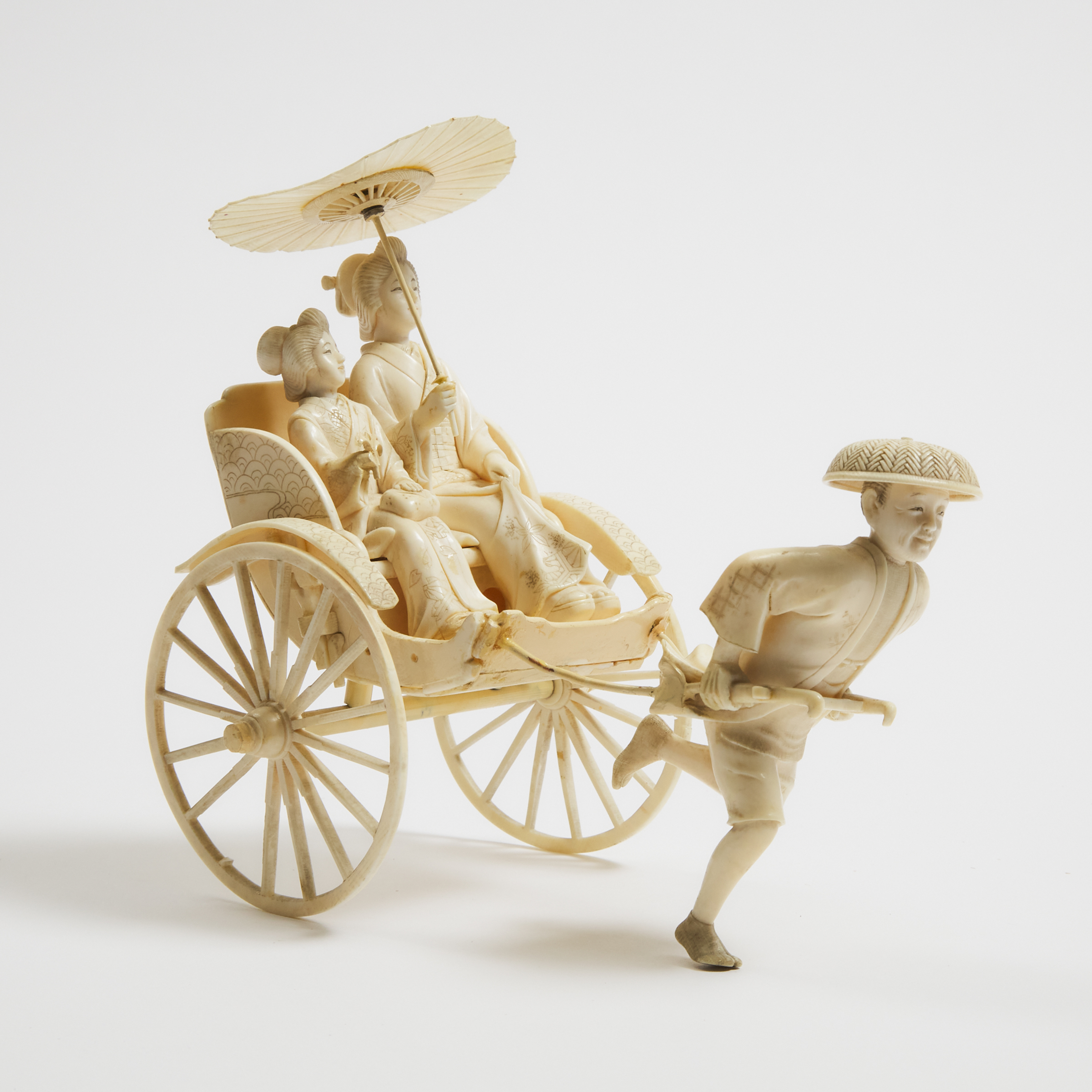 An Ivory Okimono of Two Ladies in a