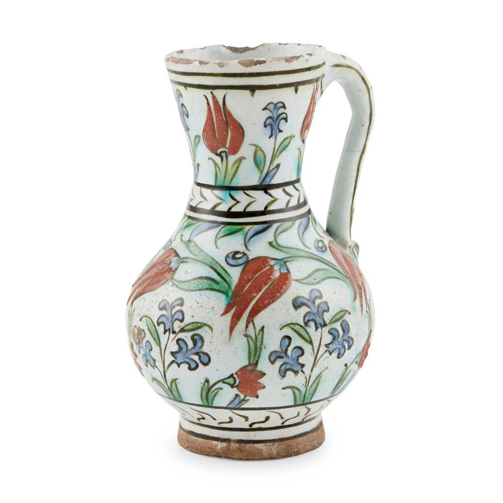 AN IZNIK POTTERY JUG WITH TULIPS