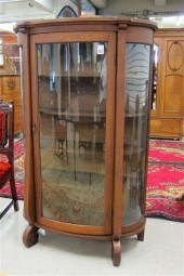 AN OAK AND CURVED GLASS CHINA