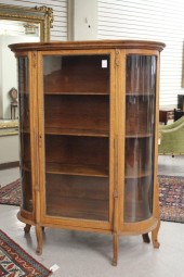 AN OAK AND CURVED GLASS CHINA