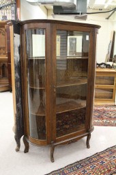AN OAK AND CURVED GLASS CHINA
