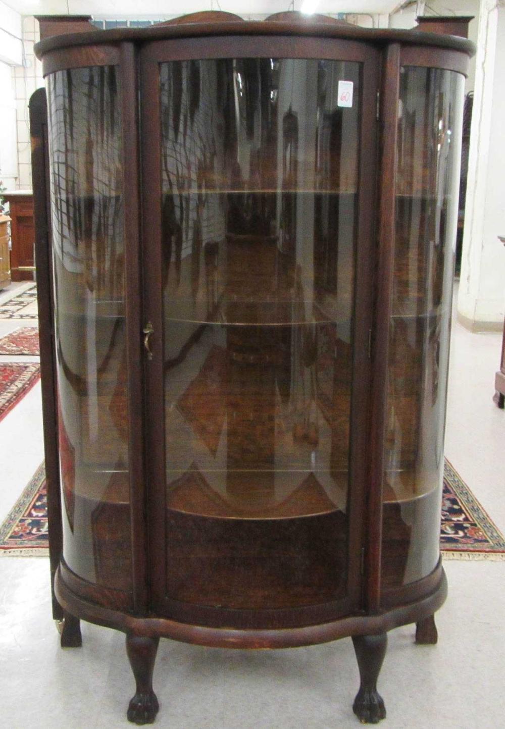 AN OAK AND CURVED GLASS CHINA