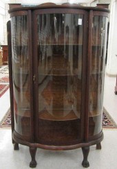 AN OAK AND CURVED GLASS CHINA