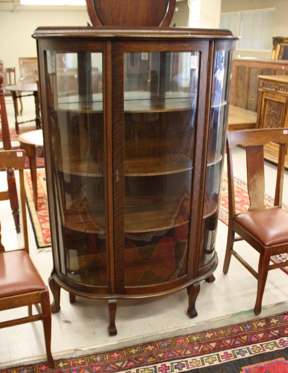 AN OAK AND CURVED GLASS CHINA