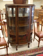 AN OAK AND CURVED GLASS CHINA