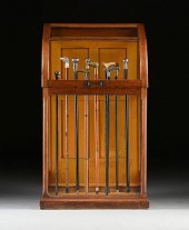 AN OAK AND GLASS CANE DISPLAY