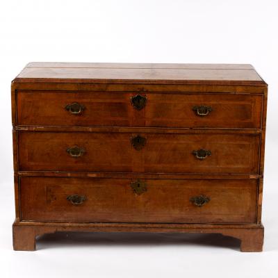 An oak and walnut chest of three