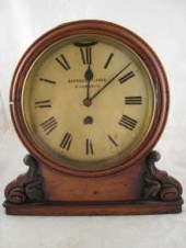 An oak boardroom bracket clock