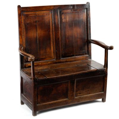 An oak box settle with twin panel