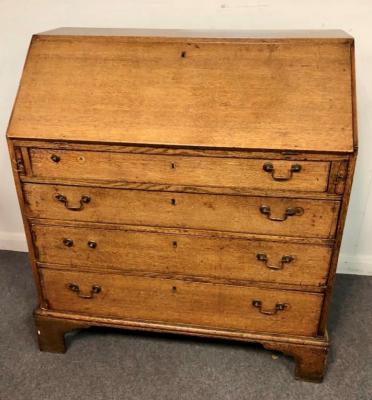 An oak bureau, the fall front