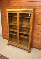 AN OAK CABINET BOOKCASE, AMERI