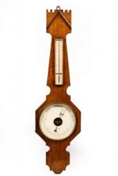 An oak cased barometer by Doll