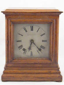 An oak cased striking mantel