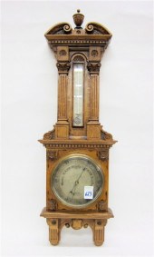 AN OAK CASED WALL BAROMETER/TH