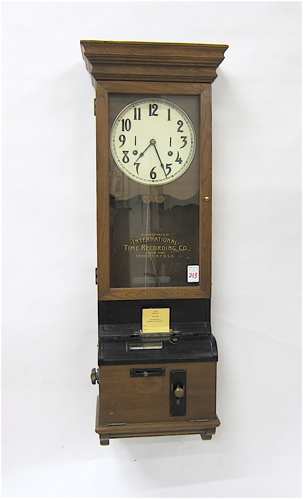 AN OAK CASED WALL-MOUNT TIME