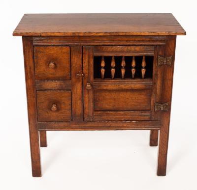 An oak cupboard enclosed by a
