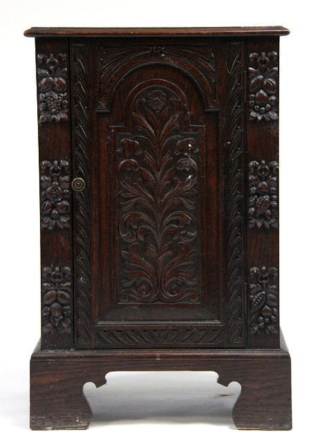 An oak cupboard fitted a single