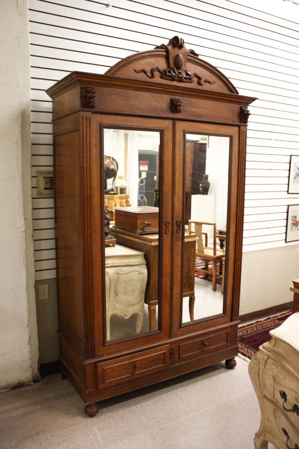 AN OAK DOUBLE-DOOR WARDROBE,