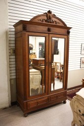 AN OAK DOUBLE-DOOR WARDROBE, C