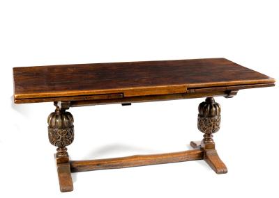 An oak draw-leaf dining table,
