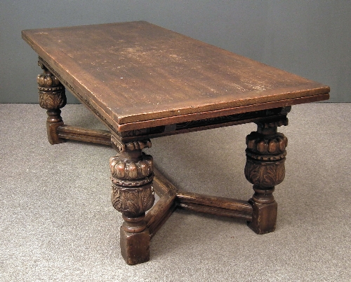 An oak draw-leaf refectory table of