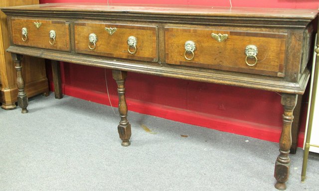 An oak dresser the three drawers
