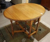 AN OAK DROP-LEAF BREAKFAST TAB