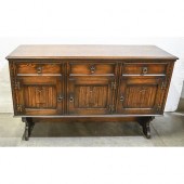 An oak gateleg table, on turne