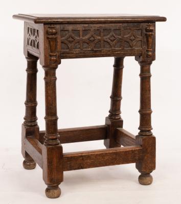 An oak joint stool on gun barrel