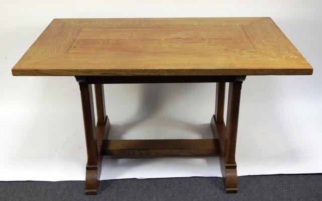 An oak kitchen table on trestle