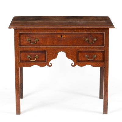 An oak kneehole desk fitted three