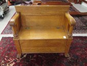 AN OAK LIFT-SEAT STORAGE SETTL