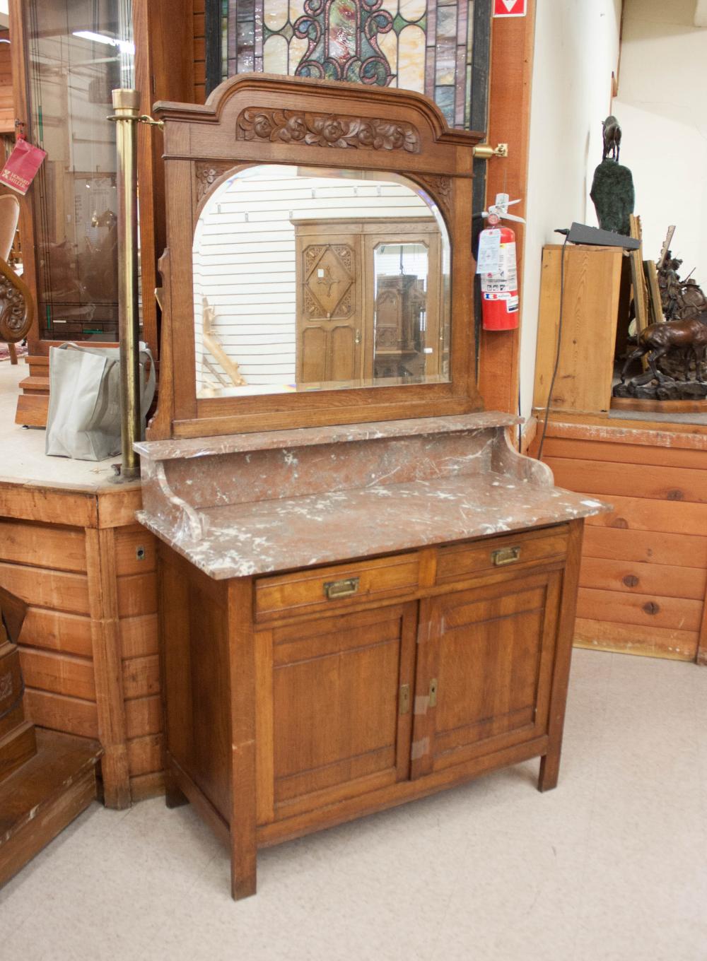 AN OAK MARBLE-TOP DRESSER WITH