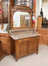 AN OAK MARBLE-TOP DRESSER WITH