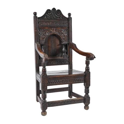 An oak panel back armchair, 17th