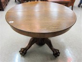 AN OAK PEDESTAL DINING TABLE W