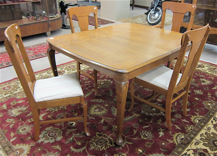 AN OAK QUEEN ANNE REVIVAL DINING