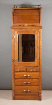 AN OAK ROLL-TOP DENTAL CABINET