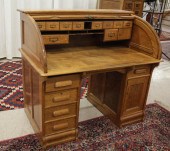 AN OAK ROLL-TOP DESK WITH CHAI
