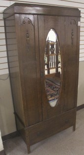 AN OAK SINGLE-DOOR WARDROBEAN