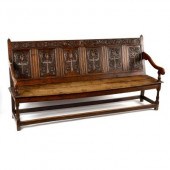 An oak six-panel back settle,