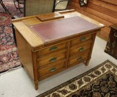 AN OAK SLIDING-TOP WRITING DES