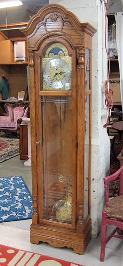AN OAK TALL CASE FLOOR CLOCK Howard