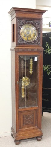 AN OAK TALL CASE FLOOR CLOCKAN